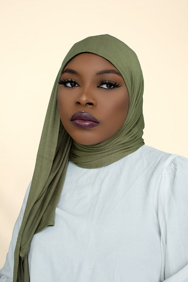 Woman gracefully draping the instant premium jersey hijab in a timeless hijab style, perfect for any occasion