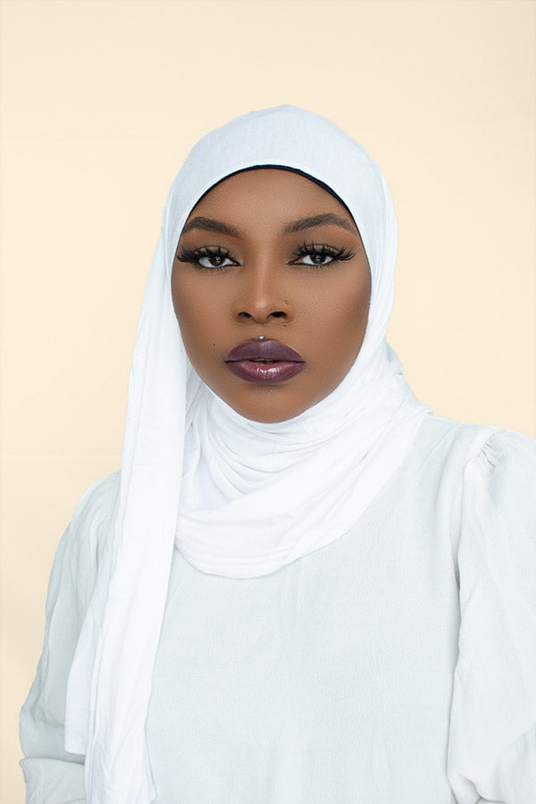 Stylish woman confidently flaunting the instant premium jersey hijab in a chic urban setting by Hijab Kingdom