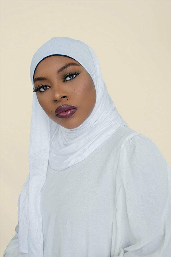 Stylish woman confidently flaunting the instant premium jersey hijab in a chic urban setting by Hijab Kingdom