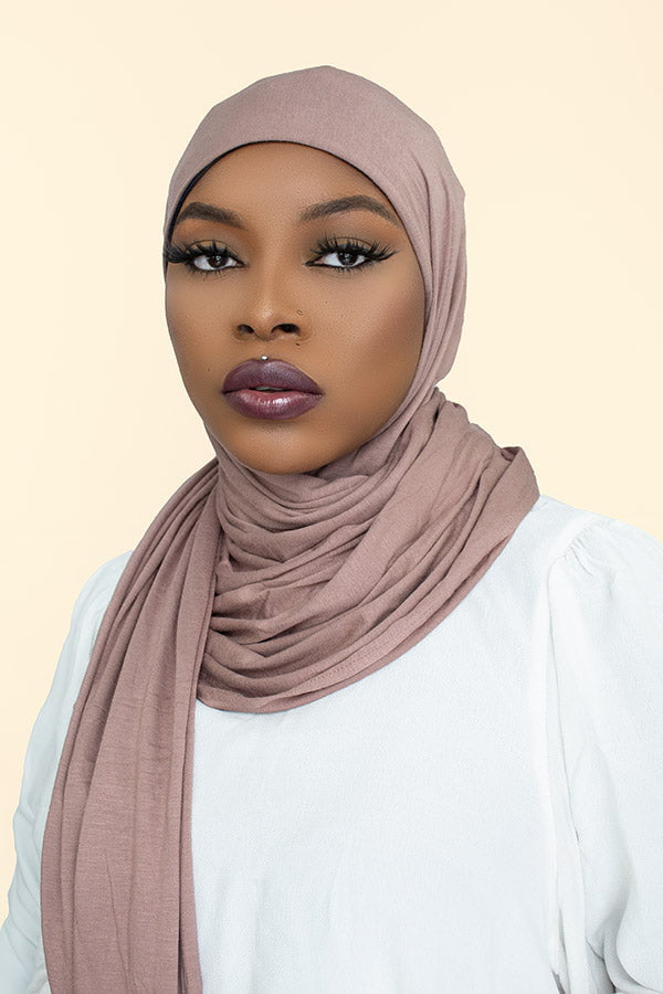 Stylish woman confidently flaunting the instant premium jersey hijab in a chic urban setting by Hijab Kingdom