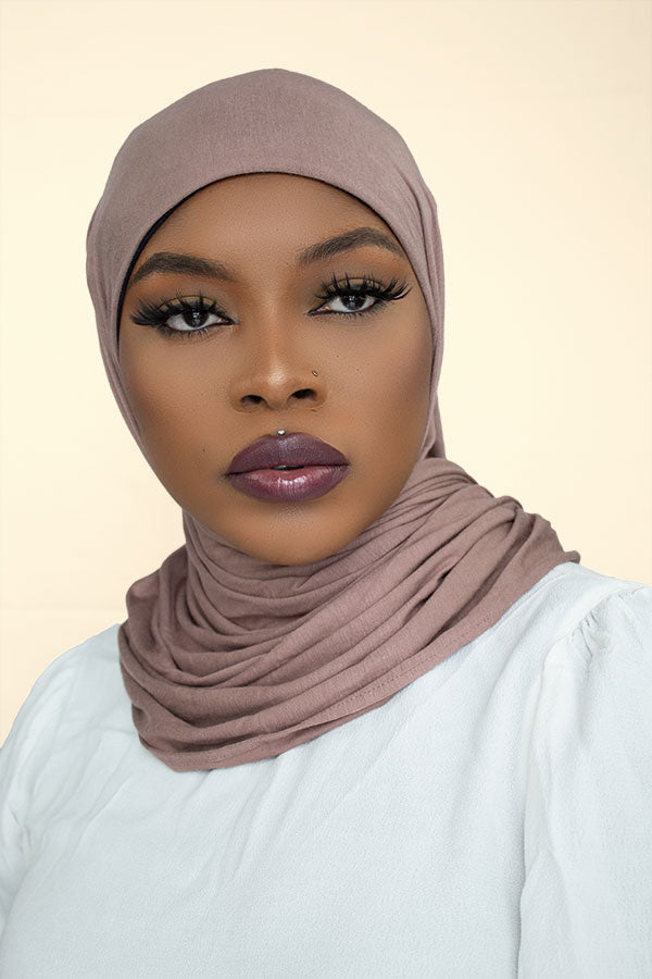 Stylish woman confidently flaunting the instant premium jersey hijab in a chic urban setting by Hijab Kingdom