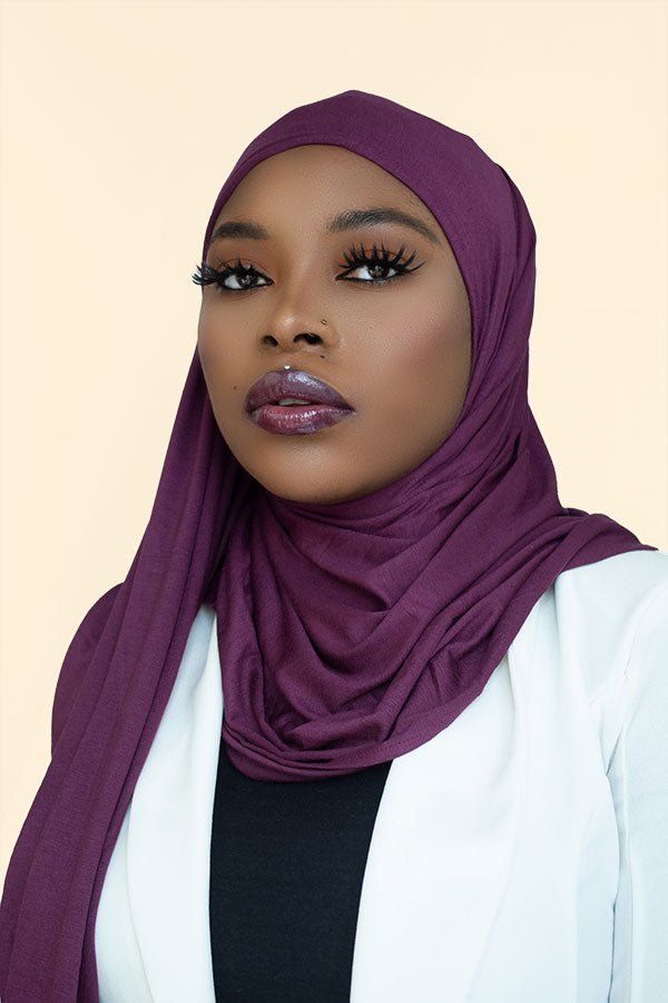 Woman gracefully draping the instant premium jersey hijab in a timeless hijab style, perfect for any occasion