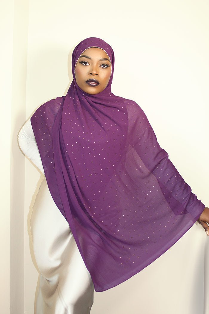 a woman is wearing dark purple diamond chiffon hijab