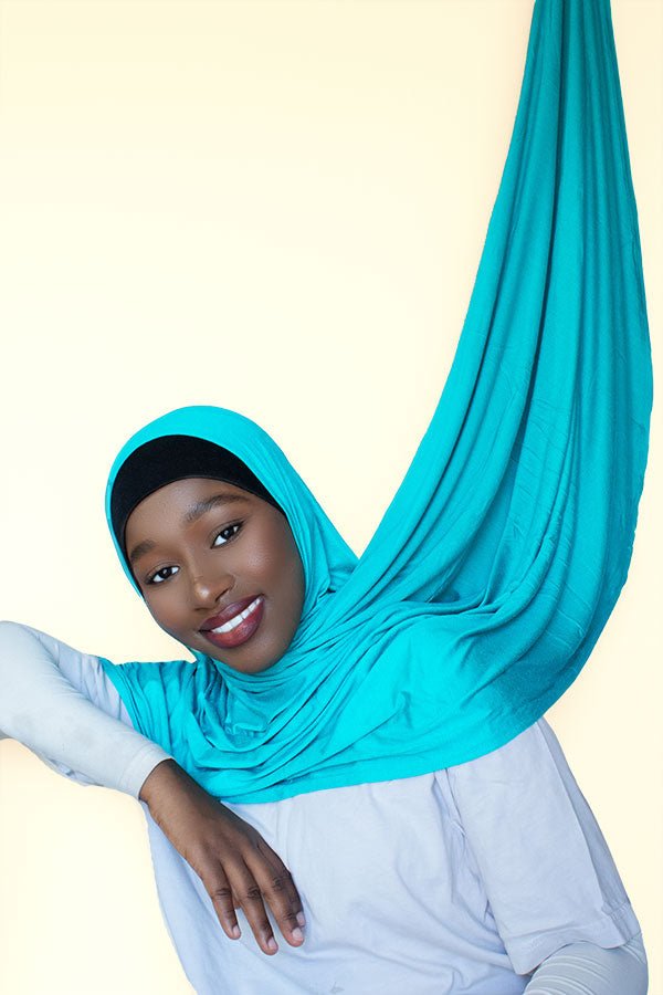 Fashionable woman showcasing the versatility of the instant premium jersey hijab, effortlessly transitioning from day to night