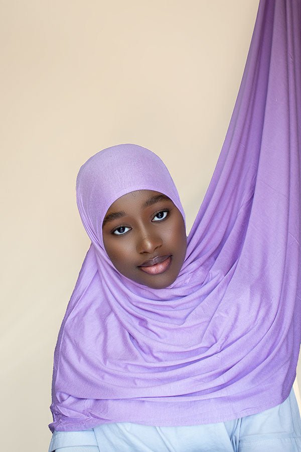 Woman showcasing blue instant premium jersey hijab in a casual outdoor setting