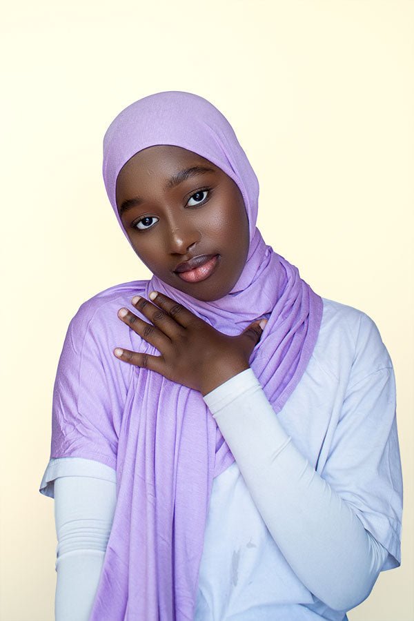 Woman showcasing blue instant premium jersey hijab in a casual outdoor setting