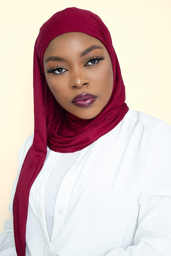 Stylish woman flaunting the instant premium jersey hijab in a vibrant color, adding a touch of elegance to her look