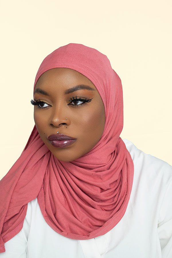 Stylish woman flaunting the instant premium jersey hijab in a vibrant color, adding a touch of elegance to her look